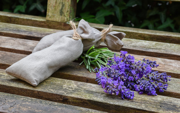 Fototapeta Fresh lavender flowers and lavender bags on rustic wood.