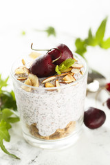 Chia pudding with sour cherry and almond flakes