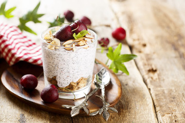 Fototapeta na wymiar Chia pudding with sour cherry and almond flakes