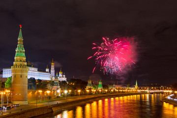 Fototapeta na wymiar Fireworks over the Moscow Kremlin at night. View of the Moscow River, Russia