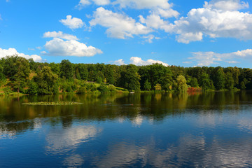 Fototapeta na wymiar Lake in natural park. Countryside landscape with carp breeding ponds. Colorful nature background.