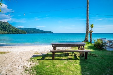 Beautiful tropical island beach with chairs - Travel summer vacation concept.