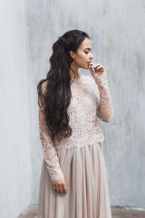 Gentle portrait of a bride in a wedding dress lace