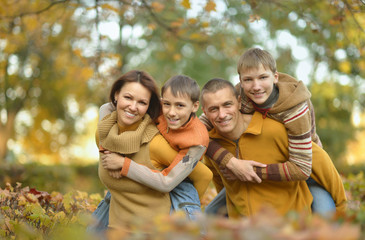 Fototapeta premium Happy family in autumn forest