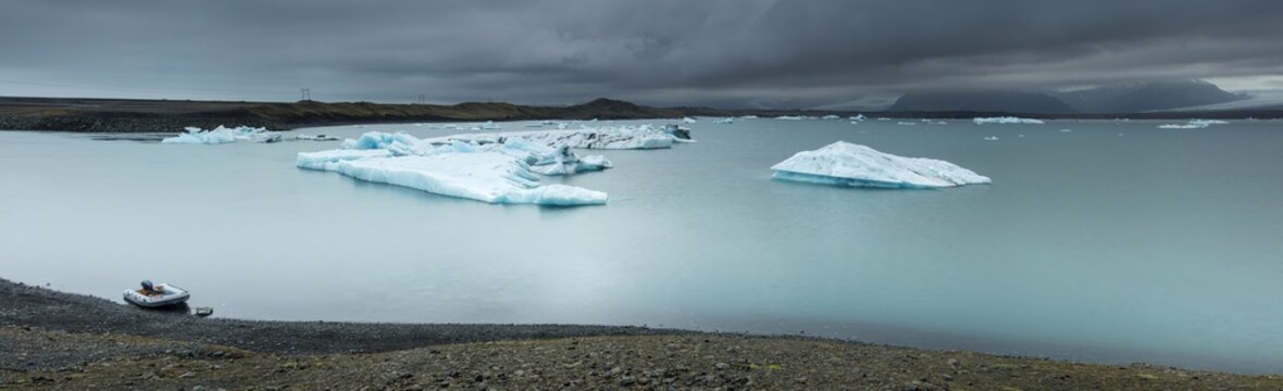 panoramic view to lagoon with floating icebergs