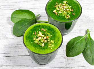 Slimming cocktail with spinach. Glasses of spinach juice.