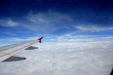 Fototapeta premium window of jet plane with blue sky and city view