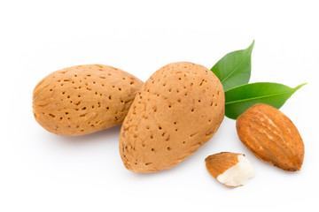 Almonds with leaves isolated on white background