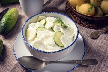 Mizeria is a Polish cucumber salad, - obrazy, fototapety, plakaty