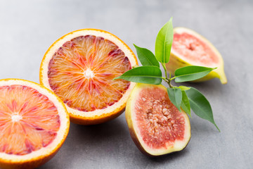 Bloody Sicilian oranges and figs. Shallow depth of field.