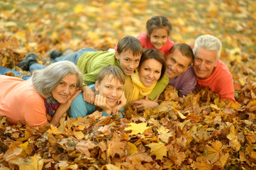 Happy family in autumn forest