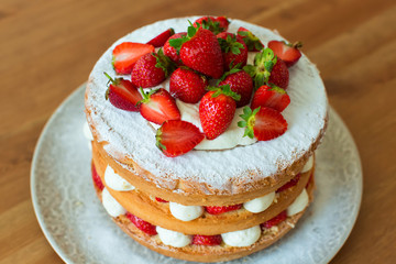 Homemade cake with strawberry and cream.