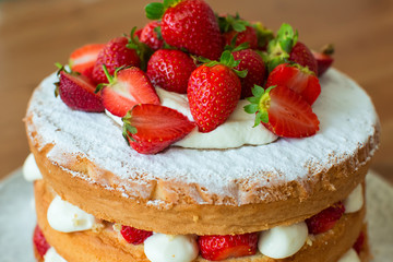 Homemade cake with strawberry and cream.