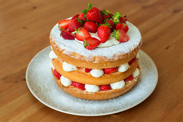 Homemade cake with strawberry and cream.