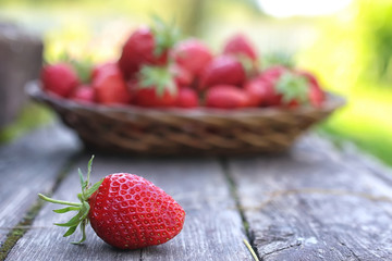 Strawberry on rustic wooden background
