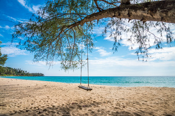Fototapeta na wymiar Swing on beautiful tropical island beach - Travel summer holiday vacation concept