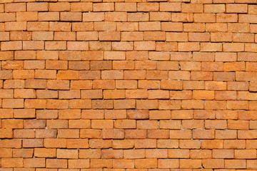Orange brick wall background.