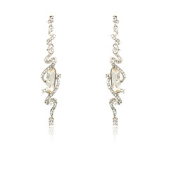 Pair of silver diamond earrings isolated on white