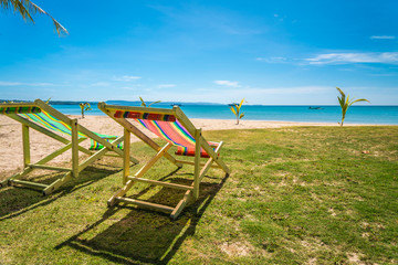 Colorful beach chair on beautiful tropical island beach summer holiday - Travel vacation concept.	