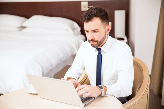 Businessman working in his hotel room