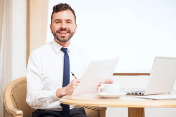Fototapeta premium Attractive attorney working in a hotel room