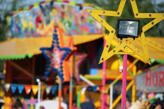 Colorful amusement park with yellow star lamp, holiday concept