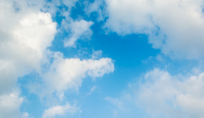 blue sky background with white clouds.