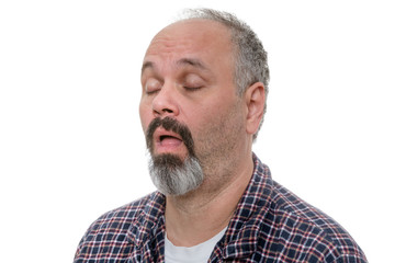 Obraz premium Balding man with beard and plaid shirt snores