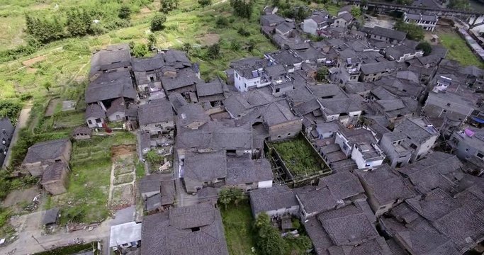 UAV aerial Chinese traditional tile roof and river, Chinese traditional bridge in ethnic minority areas, China