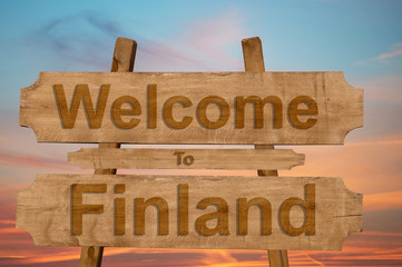 Welcome to Finland sing on wood background