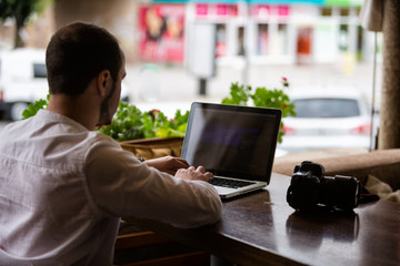 Photographer working on a laptop