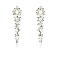 Pair of silver diamond earrings isolated on white