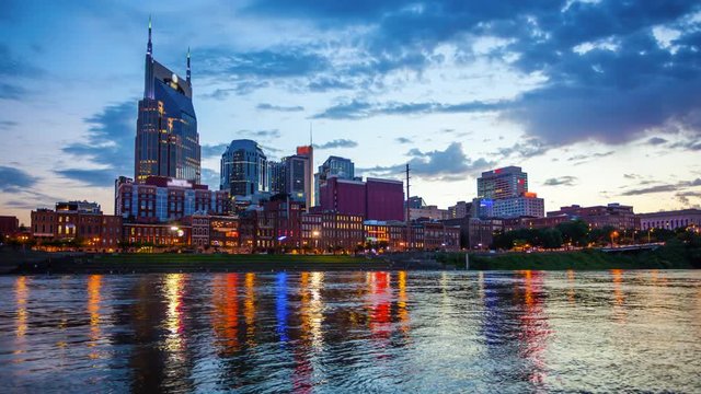 Day to night timelapse of the Nashville, Tennessee city skyline across the Cumberland River (logo's blurred for commercial use)