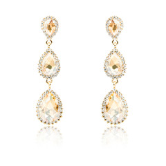 Pair of golden diamond earrings isolated on white