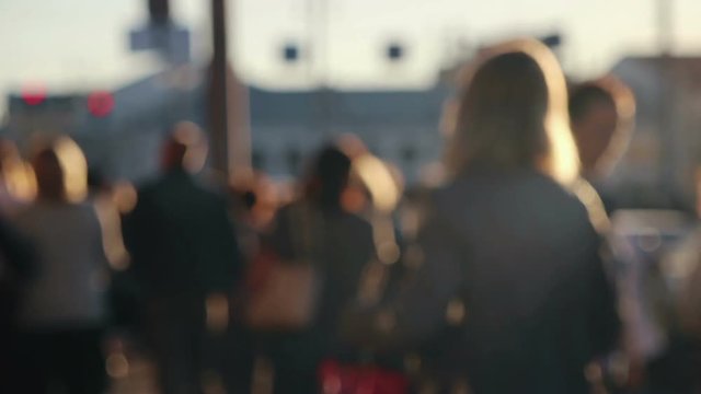 Anonymous people out of focus are walking