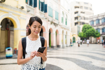 Woman using cellphone at outdoor