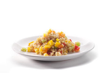 Close up of colored quinoa salad with vegetables