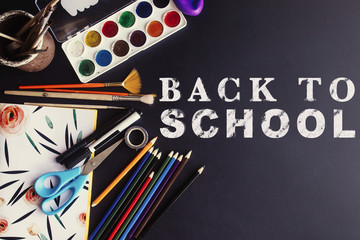 back to school concept text white chalk on black board, colorful