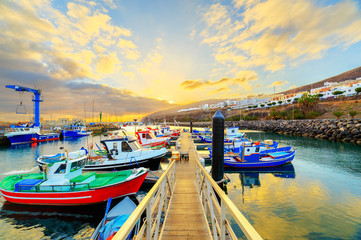 Sunset over a port in Gran Tarajal, Fuerteventura, Canary islands - obrazy, fototapety, plakaty