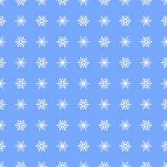 Seamless pattern snowflakes on a beautiful blue background