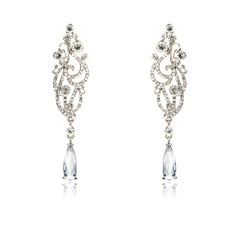 Pair of silver diamond earrings isolated on white