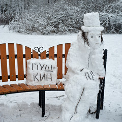 Alexander Pushkin famous poet is made from snow. (the text on the plate: PUSHKIN)