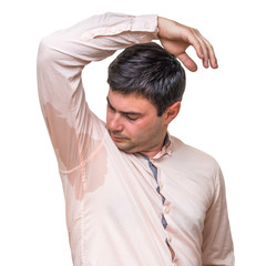 Man with sweating under armpit in pink shirt isolated on white