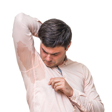 Man With Sweating Under Armpit In Pink Shirt Isolated On White