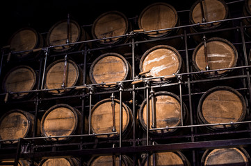 wooden barrel alcohol, oak barrels in cellar, wall of container to alcohol