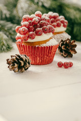 Christmas cupcakeon rustic background