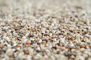 Gravels background, colorful sand close up, selective focus