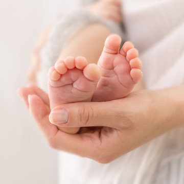 baby feet in mother hands 