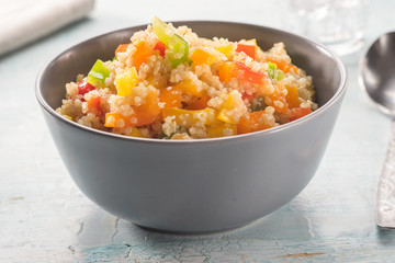 Close up of quinoa salad on blue old wooden table