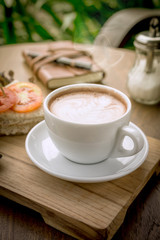 Coffee cup and sandwiches